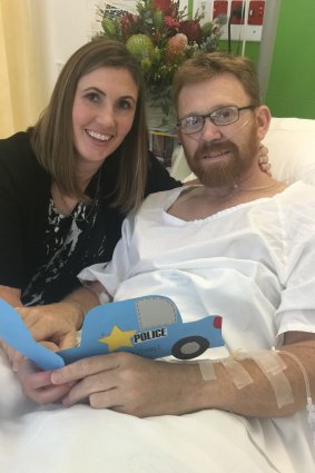 Sergeant Warburton, pictured with his wife, has had 14 surgeries since he was shot.