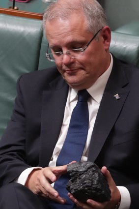 Treasurer Scott Morrison with a lump of coal during question time.