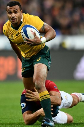 Will Genia makes a break past Maxime Machenaud of France during a Test in 2016. 