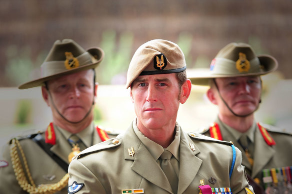 Ben Roberts-Smith, middle, after receiving his Victoria Cross in 2011.