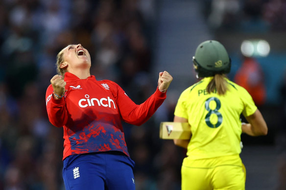 Sophie Ecclestone celebrates England’s victory in a match during which she became the fastest woman to 100 T20 international wickets.