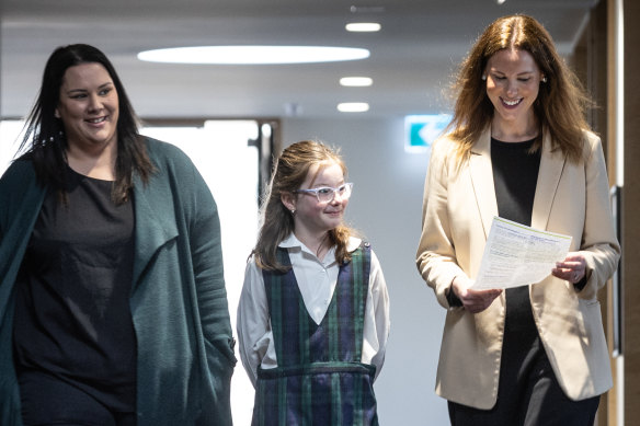 Keeping parents informed: Mother Kelly Toyne with her grade five daughter Avery and Christ the King School principal Louise Vakirevic.