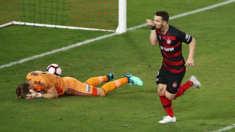 Sight for sore eyes: Alex Baumjohann scores from the spot for the Wanderers.