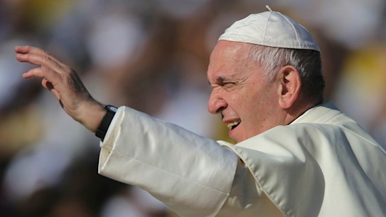 Pope Francis blesses worshippers during a Mass at the Sheikh Zayed Sports City in Abu Dhabi.