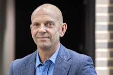 Neal Reed, chief executive at Procter & Gamble Australia and New Zealand, leans against a railing at the company’s Sydney head office.
