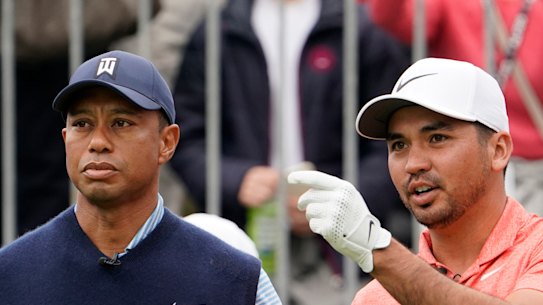 Tiger Woods (left) sympathises with Jason Day's infrequent appearances in Australia.