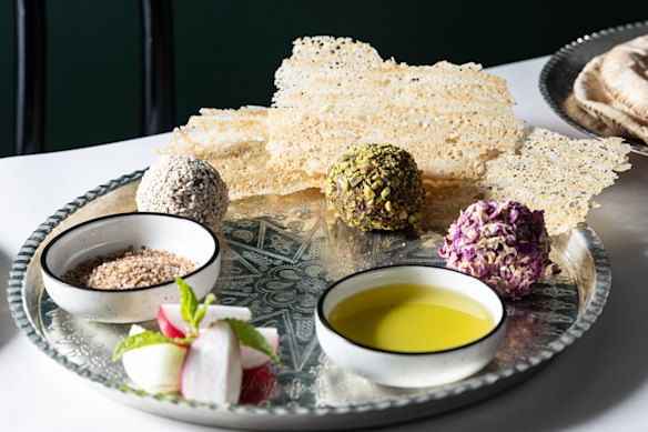 Lamb naye balls coated with sesame seeds, crushed pistachio and dried rose petals.