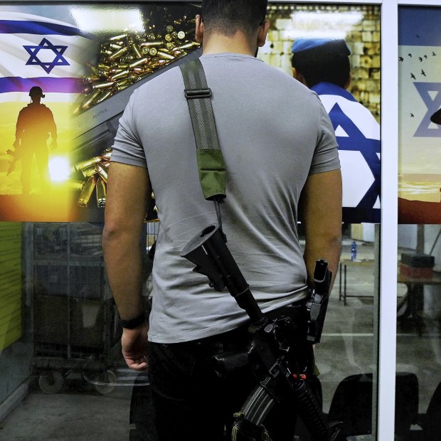 Almog Meirov attends a shooting range on the outskirts of Tel Aviv. The Israeli government has relaxed gun laws to allow citizens to carry a weapon if they have done military service and passed a medical and practical tests.
