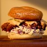“The Tokyo” fried chicken bagel with cabbage slaw, provolone cheese and chilli-mayo at Roman’s Deli.