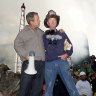 George W. Bush stands with firefighter Bob Beckwith on a burnt fire truck in front of the World Trade Centre during a tour of the devastation on September 14, 2001.