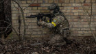 Civilians take part in a military training activity day conducted by the Ukrainian Volunteer Army in Kyiv.