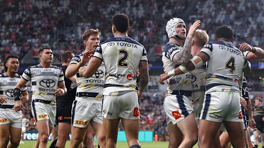 The Cowboys celebrate a try on Friday.