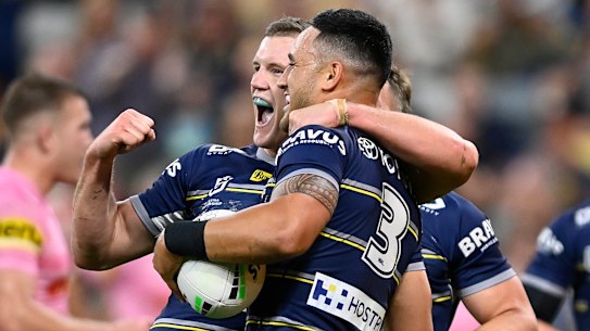 Valentine Holmes celebrates a try.