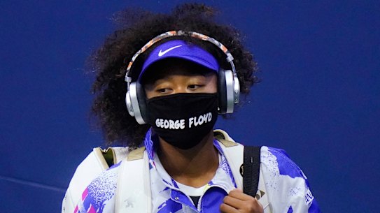 All masked up and coming to Australia: Naomi Osaka in the quarter-finals of the US Open in September.