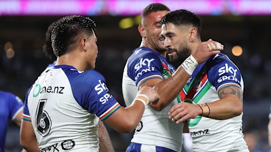Shaun Johnson celebrates a Josh Curran try against the Bulldogs.