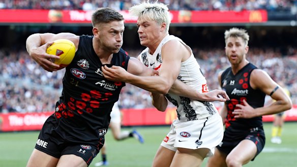 Man of the moment Jack Ginnivan lays a tackle on Jayden Laverde.