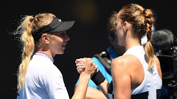 Kvitova shakes hands with Amanda Anisimova after their match.