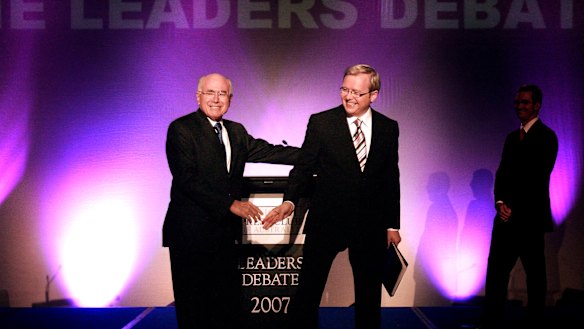 John Howard and Kevin Rudd shake hands ahead of the 2007 debate.