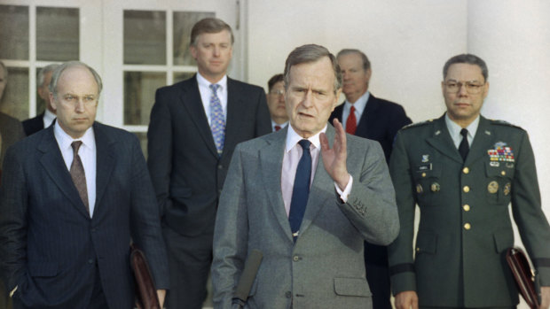 President George HW Bush, centre, pictured in 1991 in the Rose Garden of the White House with, from left, Defence Secretary Dick Cheney, Vice President Dan Quayle, White House Chief of Staff John Sununu,  Secretary of State James A Baker III, and Joint Chiefs Chairman General Colin Powell. 