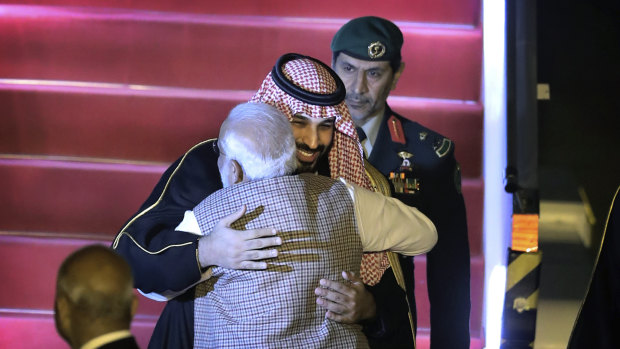 Saudi Crown Prince Mohammed bin Salman is hugged enthusiastically by Indian PM Narendra Modi at the airport in Delhi.