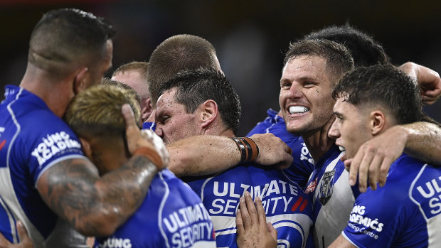 The Bulldogs celebrate their opening round win against the Cowboys.