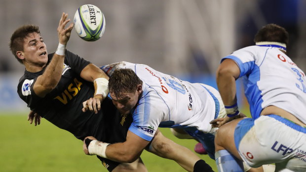 Loading up: Roelof Smith offloads during a tackle in the Jaguares' win over the Bulls.