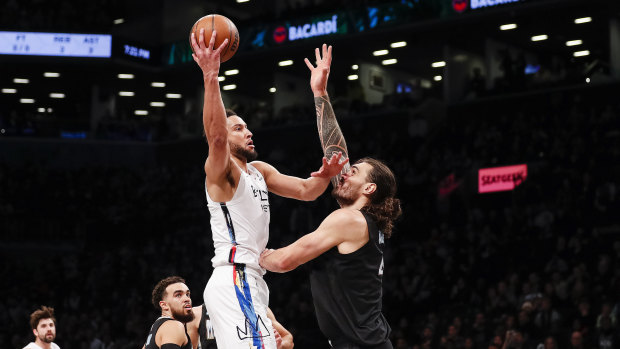 Australian star Ben Simmons shoots over New Zealand big man Steven Adams in Brooklyn’s win over Memphis.