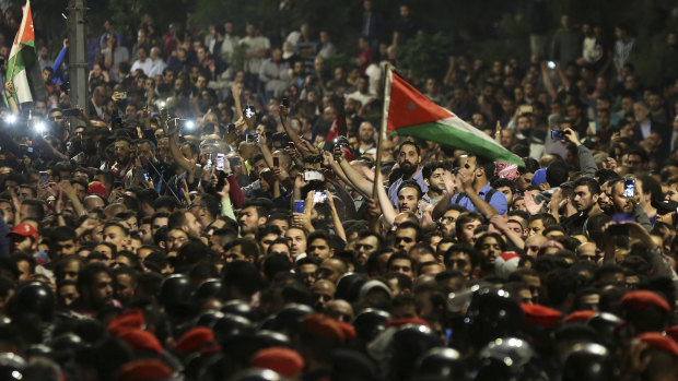 Thousands of protesters face off with police  outside Prime Minister  Hani Mulki office in the capital Amman.