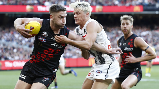 Man of the moment Jack Ginnivan lays a tackle on Jayden Laverde.