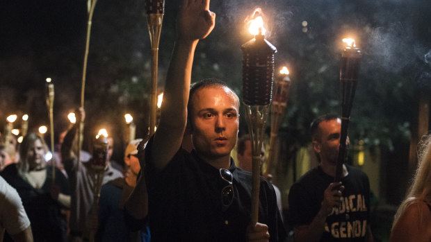 Torch-bearing white nationalists rally around a statue of Thomas Jefferson in Charlottesville in 2017.