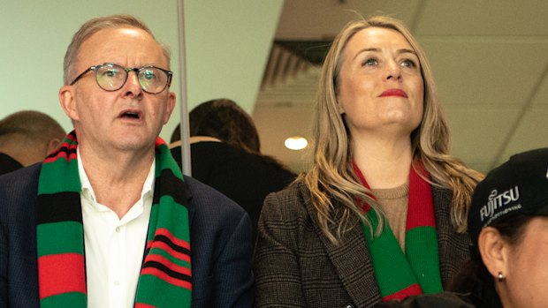 There's no place like home, so how about staying for a while? Premier Anthony Albanese and partner Jodie Haydon watch the South Sydney Rabbitohs in action. 