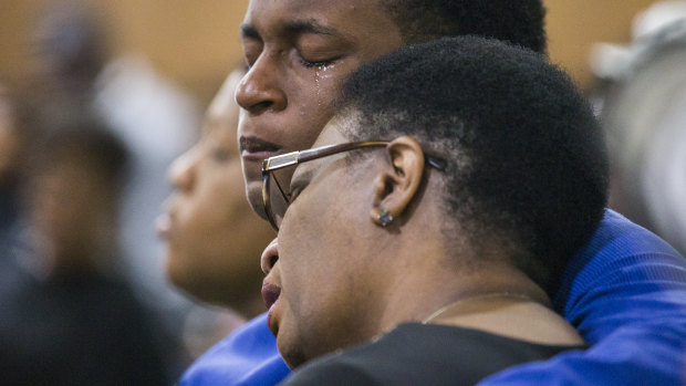 Allison Jean and her son Grant, 15, mourn Botham Jean, Allison's son and Grant's brother during a prayer service for Jean at the Dallas West Church of Christ on Sunday.