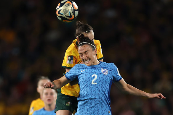 England’s Lucy Bronze heads the ball away from Caitlin Foord.