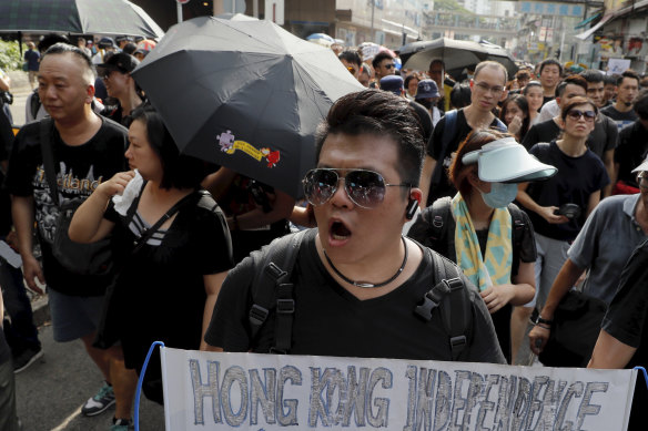 A protester holds up a banner calling for independence in Hong Kong.