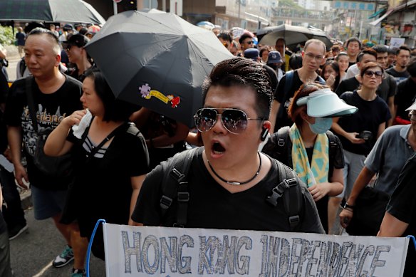 A protester holds up a banner calling for independence in Hong Kong.