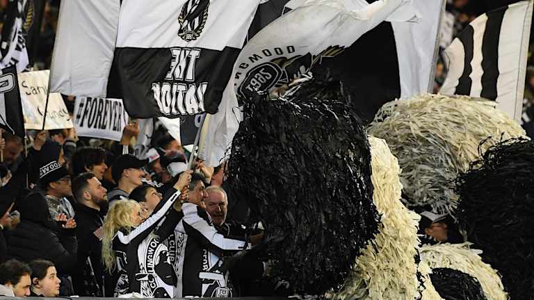 Black and white army: Pies fans out in force during the win over Greater Western Sydney on Saturday night.