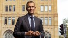 Faith Housing Alliance chief and former planning minister Rob Stokes in front of Scots Church which has apartments built on top of it.