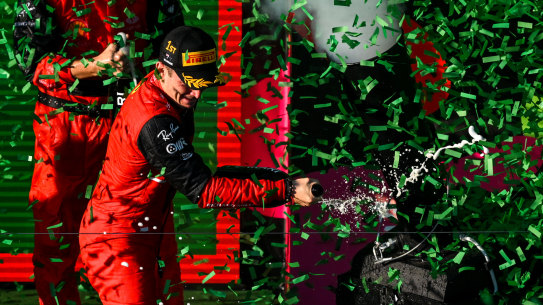 Leclerc celebrates on the podium.