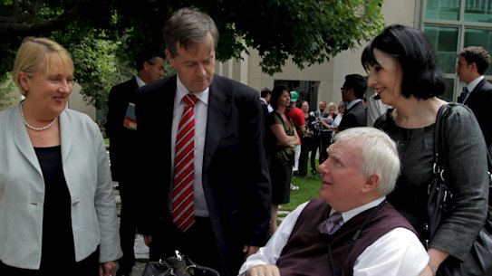 John Walsh (bottom right) in 2011, then associate commissioner of the Productivity Commission, with ministers in the then-Labor government, Jenny Macklin and Bill Shorten.