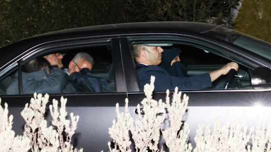 Iranian officials leave the Iranian embassy in Canberra on Tuesday night, after ambassador Ahmad Sadeghi was expelled from the country.