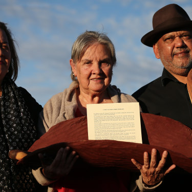 Megan Davis, Pat Anderson and Noel Pearson with a piti holding the Uluru Statement from the Heart.