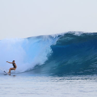 Brooke Farris surfing in Fiji.