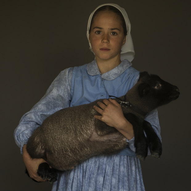 Mary, 10, with her pet lamb Domino.