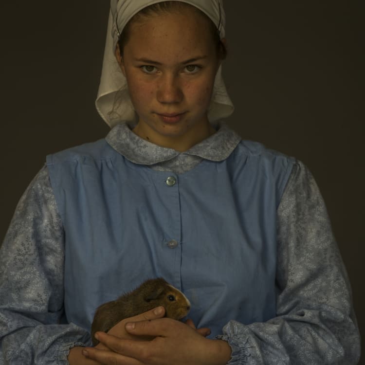 Elizabeth, 12, holds her pet guinea pig.