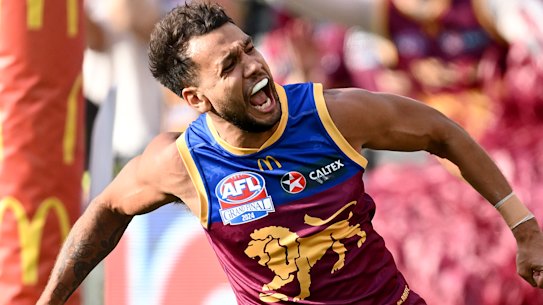Callum Ah Chee of the Lions celebrates kicking a goal during the AFL Grand Final match between Sydney Swans and Brisbane Lions at Melbourne Cricket Ground.