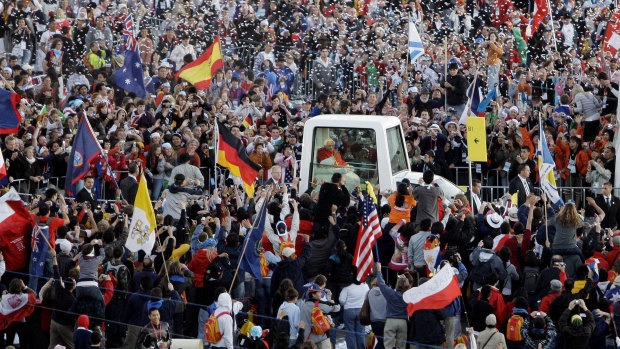 Up close and personal ... the crowds greeting Pope Benedict XVI at World Youth Day in Sydney in 2008.