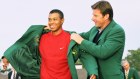 Tiger Woods Puts On The Green Jacket With The Help Of Nick Faldo During The Presentation Ceremony Of The 1997 Masters Tournament .