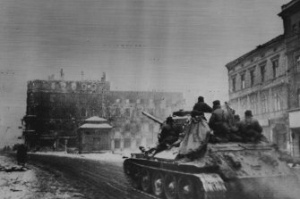 A Russian tank of the First Ukrainian Army rolls along a street in Gleiwitz, German Silesia, following the capture of the city by Soviet Forces, on February 5, 1945.