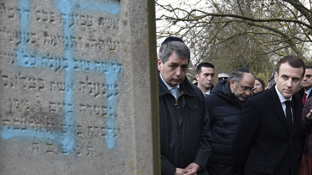 President Emmanuel Macron at the vandalised Jewish cemetery in Quatzenheim, France. 