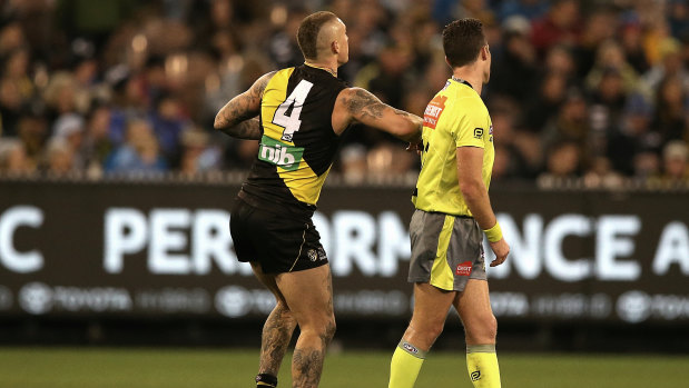 Controversial decision: Dustin Martin's contact with umpire Jacob Mollison was ruled as careless.